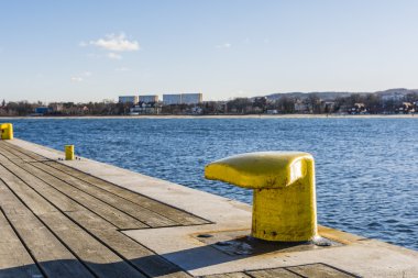 Yellow bittes in harbor.
