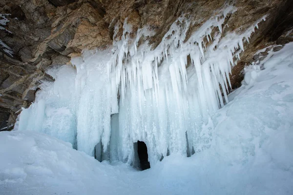 Ice cave, Icicles in the rocky caves, Lake Baikal in winter, Siberia, Russia