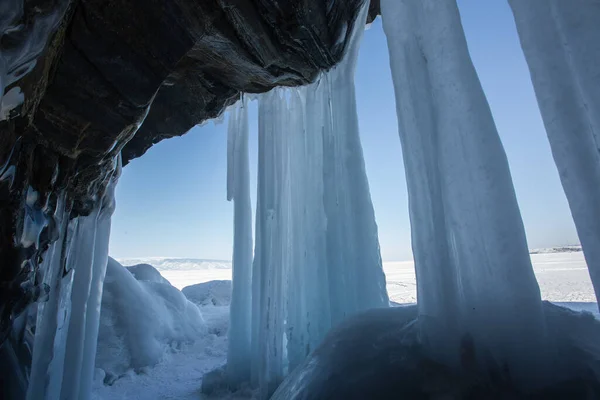 Ice cave, Icicles in the rocky caves, Lake Baikal in winter, Siberia, Russia