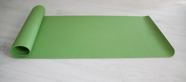 Green yoga carpet — Stock Photo, Image