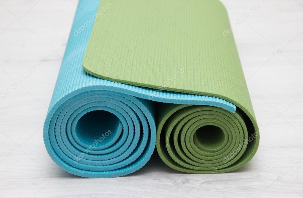 two yoga iyengar mats green and blue colors