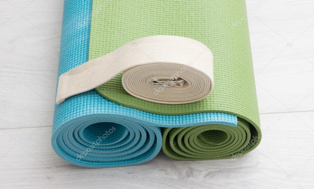 two yoga mats and belt