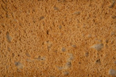 Bir dilim ekmeğin dokusu - üst manzara ve bir dilim ekmeğin yakın çekimi