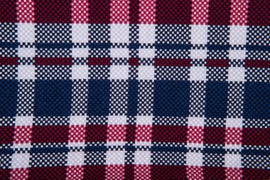 Damalı kumaşın dokusu - üst görünüm ve kareli bir masa örtüsünün yakın görüntüsü