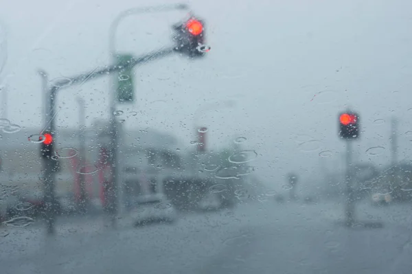 Red Traffic Lights City Street Seen Vehicle Windscreen Driving Rain — Stock Photo, Image