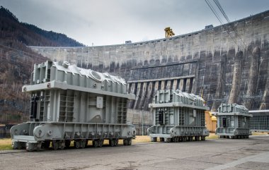 Power generators on a background of the dam of Sayano-Shushenska