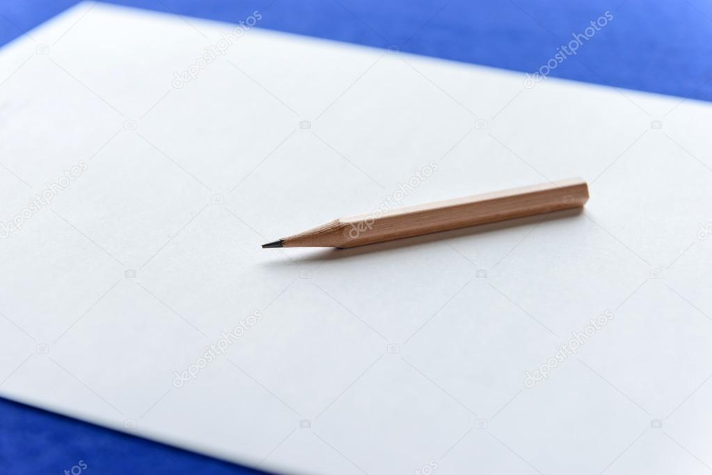 Wooden Pencils on white paper with copy space