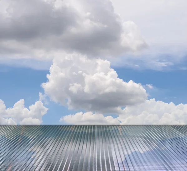 Clouds and sky reflection on glass floor — Stock Photo, Image