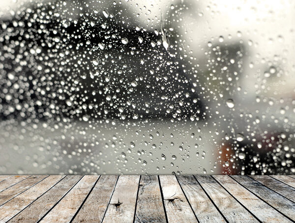 Wood floor with rainy drop on the mirror background