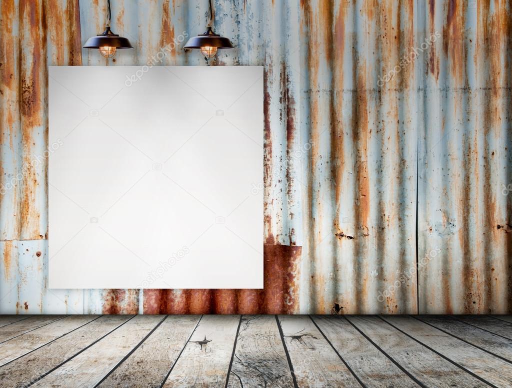 Blank frame on Rusted galvanized iron plate with wood floor
