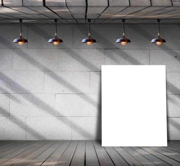 Poster standing on wood floor with Grungy concrete wall — Stock Photo, Image