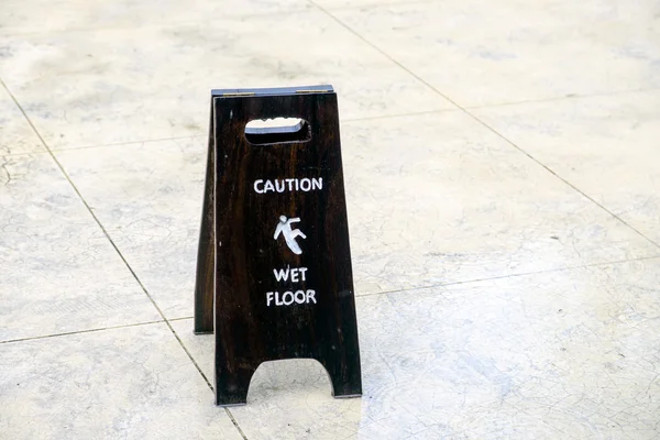 Sign warning of caution wet floor on floor — Stock Photo, Image