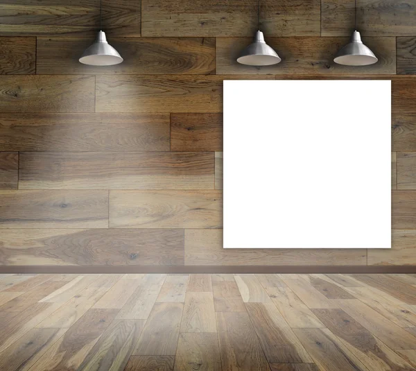 Пустой каркас на деревянной стене с потолочной лампой — стоковое фото