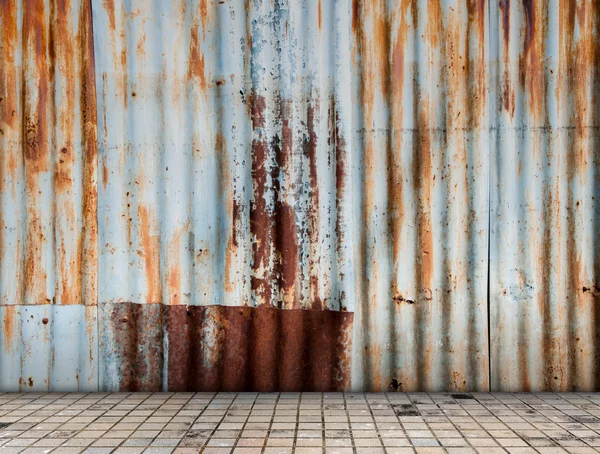 Rusted galvanized iron plate with tile floor — Stock Photo, Image