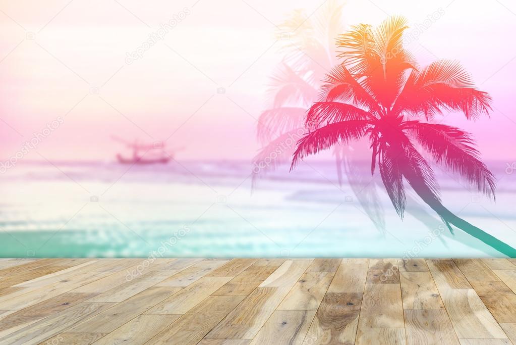 Wooden terrace with Coconut palms silhouette