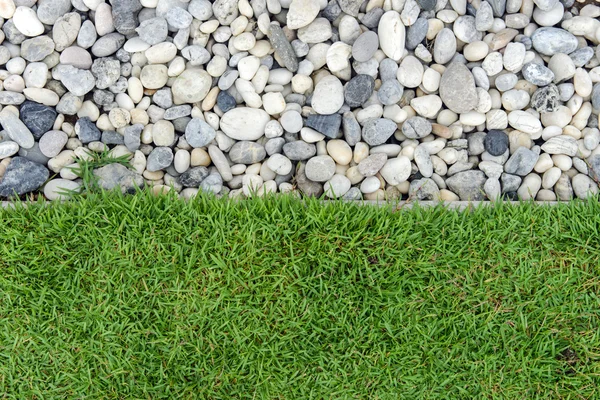 Green grass with Pebbles, Stone and grass in garden, grass with rock, Pebble with Grass, background — Stock Photo, Image