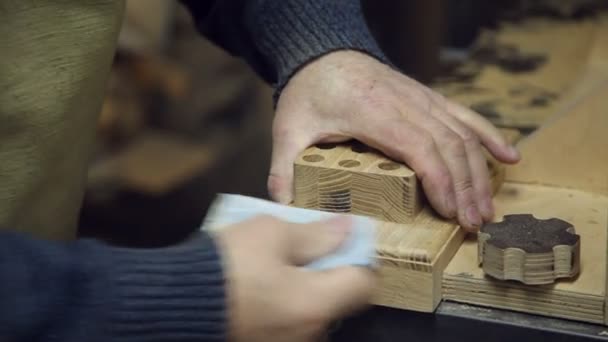 Man sandpaper grinds wood — Stock Footage Man sandpaper grinds wood Royalty Free Stock Footage