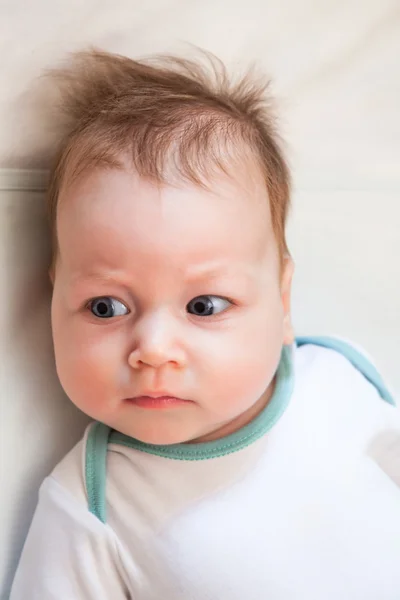 Disheveled baby looking sideways — Stock Photo, Image