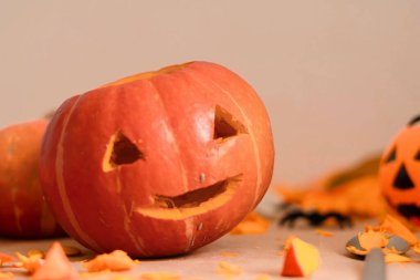Cheerful Halloween pumpkin with festive decorations.