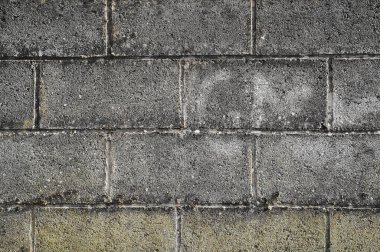 Beautiful closeup view of grey concrete block wall near Ballawley Park, Sandyford, Dublin, Ireland. High resolution construction background. Concrete block laying