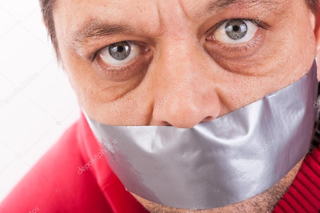 Man with tape gagged mouth