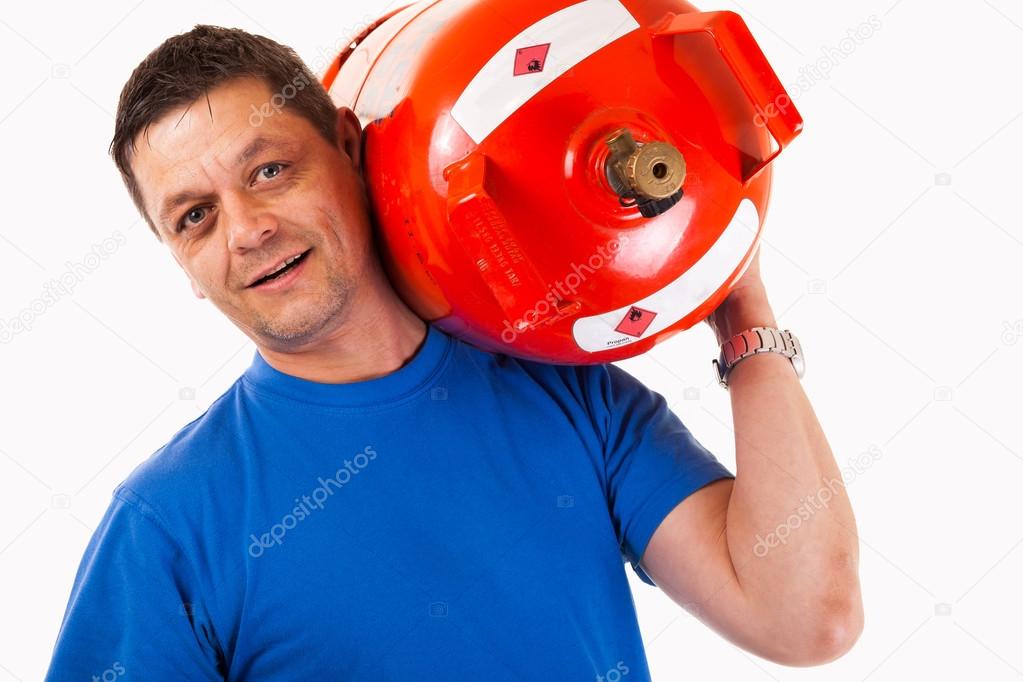 A man wearing a gas cylinder on his shoulder