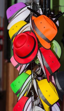 A colorful hat rack at a market clipart