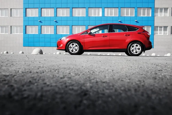 Red car Ford Focus III Sport on asphalt parking at daytime — Stock Photo, Image