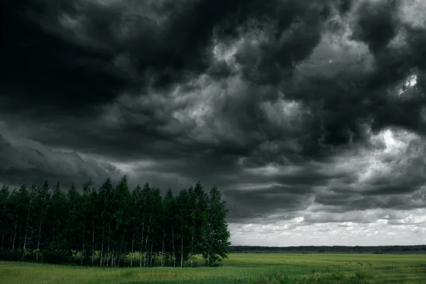 Dramatic thunder storm clouds at dark sky. Nature landscape