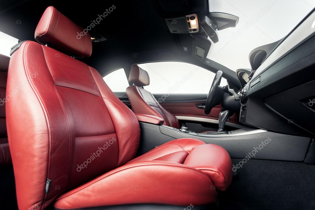 Modern interior of premium car with leather red seats