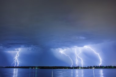 Lighting thunder bolt reflected water