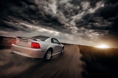 Car drive speed fast on the off-road ford mustang