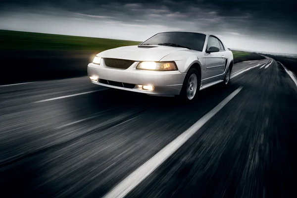 Car drive speed fast on the asphalt road ford mustang