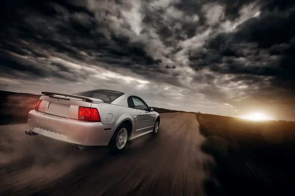 Car drive speed fast on the off-road ford mustang — Stockfoto