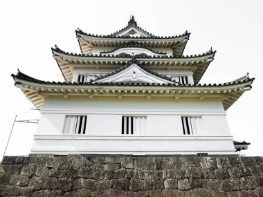 Uwajima, Japan - April 9, 2018: Main keep of historic Uwajima castle, one of the 12 original Edo period castles of Japan clipart