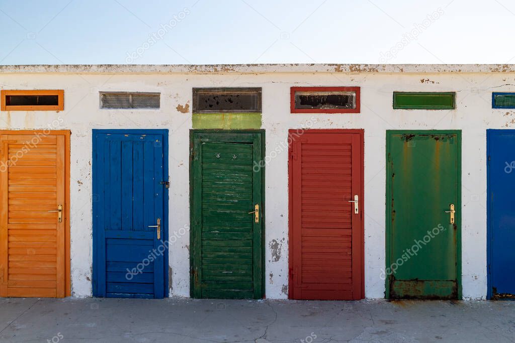 Popular colorful doors on the changing rooms by the Jadrija beach at the famous town of Sibenik, Croatia