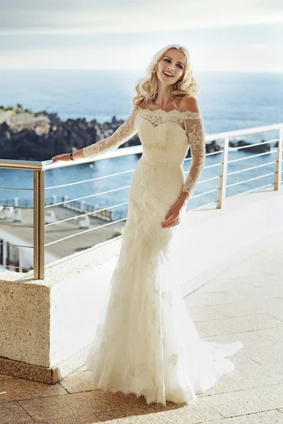 Charming and cheerful bride on the balcony — Stock Photo, Image