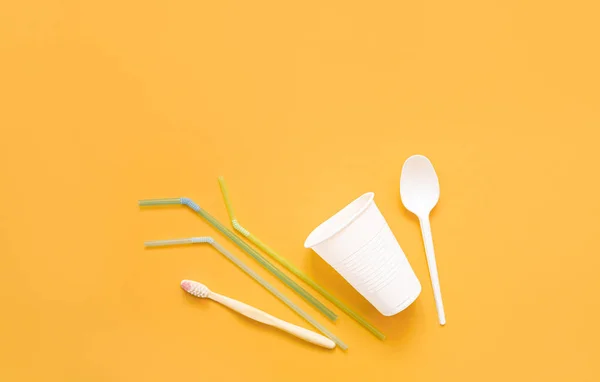 Collection Plastic Waste Cup Spoon Plastic Toothbrush Straws Yellow Background — Stock Photo, Image