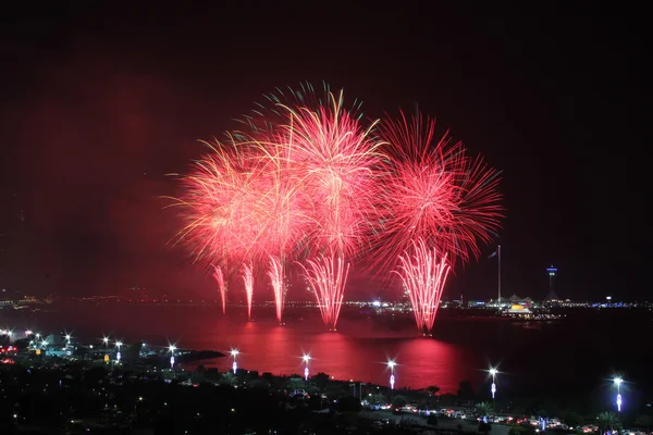 Red coastal firework display — Stock Photo, Image