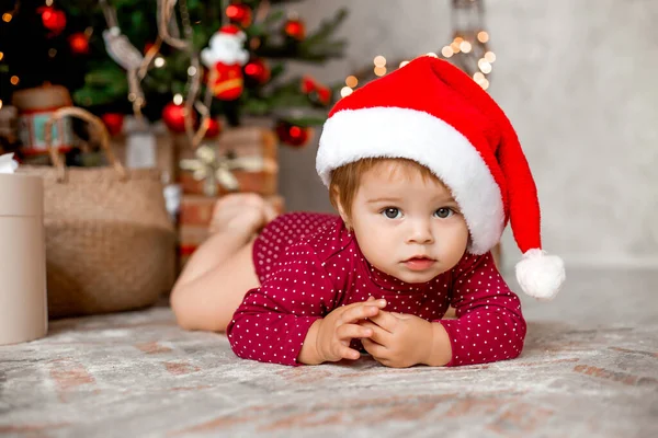 Cute Baby Santa Sits Home Christmas Tree Gifts — Stock Photo, Image