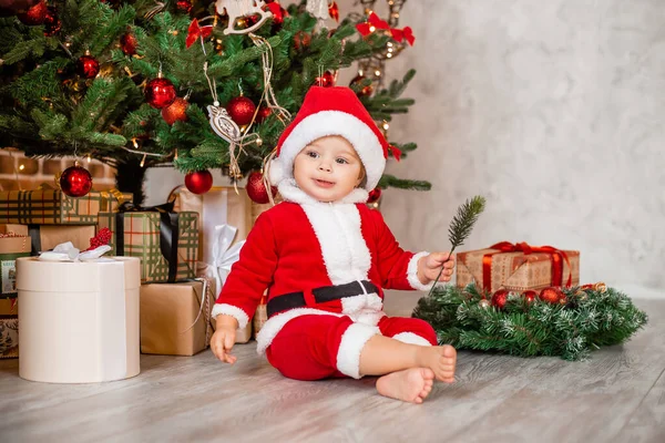 Cute Baby Santa Sits Home Christmas Tree Gifts — Stock Photo, Image