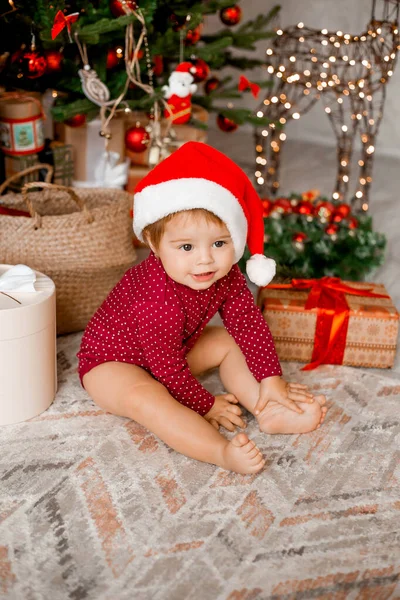 Cute Baby Santa Sits Home Christmas Tree Gifts — Stock Photo, Image