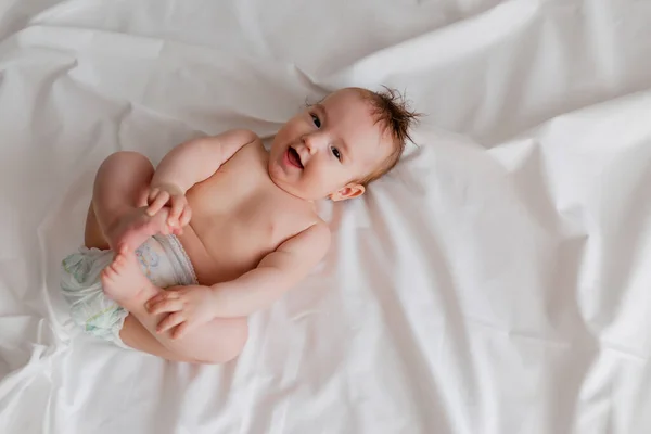 Overhead View Cute Baby Lying White Sheets — Stock Photo, Image