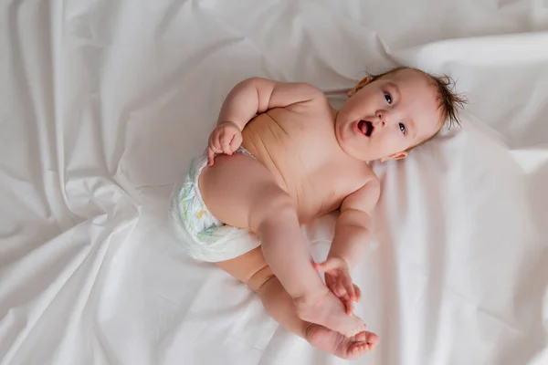 Overhead View Cute Baby Lying White Sheets — Stock Photo, Image