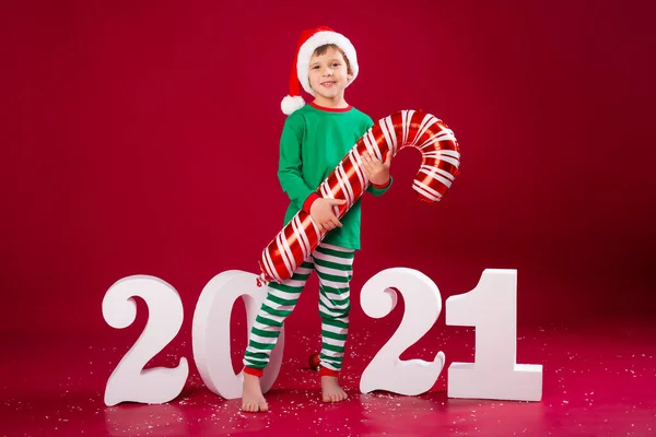 Smiling Boy Santa Hat Holding Candy Cane Balloon Standing 2021 — Stockfoto