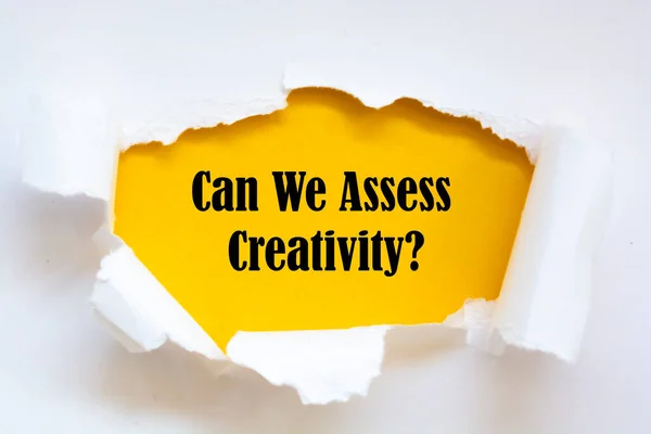 Can We Assess Creativity? question written under torn paper.