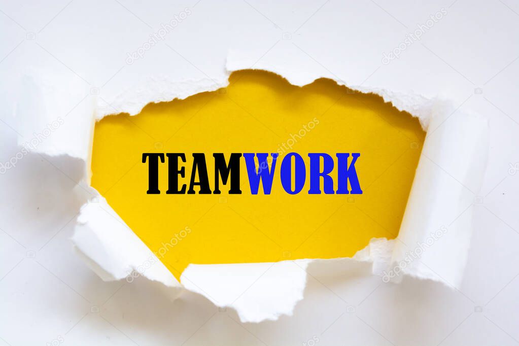 TEAMWORK text on white envelope and torn paper. Concept Image