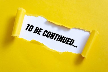 devam edecek, yırtık kağıt arkaplan üzerine beyaz kağıt üzerine metin