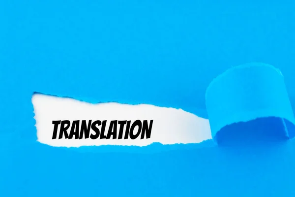 Traducción Texto Que Aparece Detrás Papel Azul Rasgado — Foto de Stock