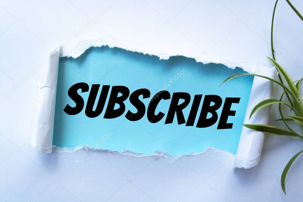 The word subscribe appearing behind torn paper